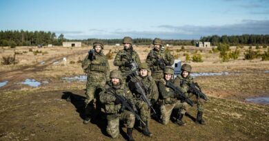 Spanish soldiers assigned to NATO's enhanced Forward Presence Battlegroup in Latvia, pose for a photo during weapons training at Camp Ādaži on 18 February 2022; Photo via: flickr