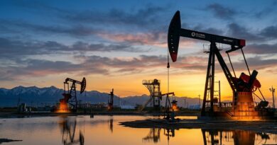 Silhouette of oil pumpjacks at sunset with mountains in background, representing rising global oil prices in 2026