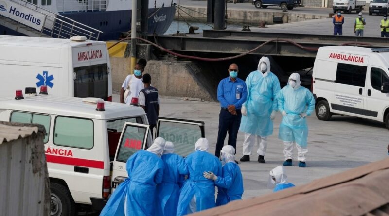Health workers in protective gear on Wednesday evacuate patients from the MV Hondius cruise ship into an ambulance at a port in Praia